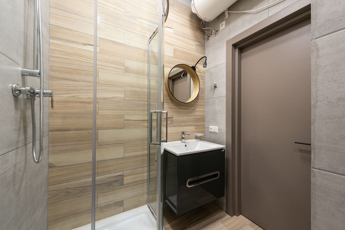 Walk-in shower with clean tile and glass