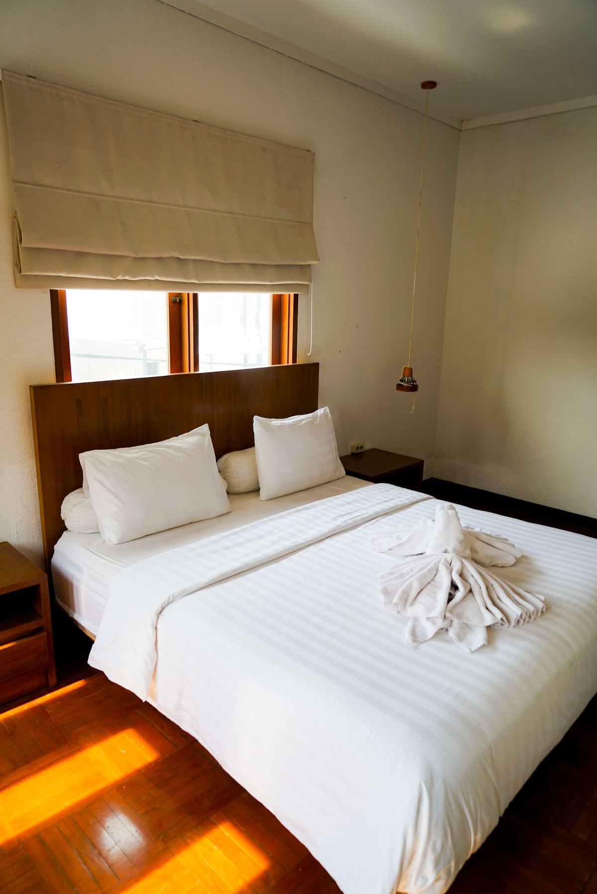 Hotel-style bed made for the next guest