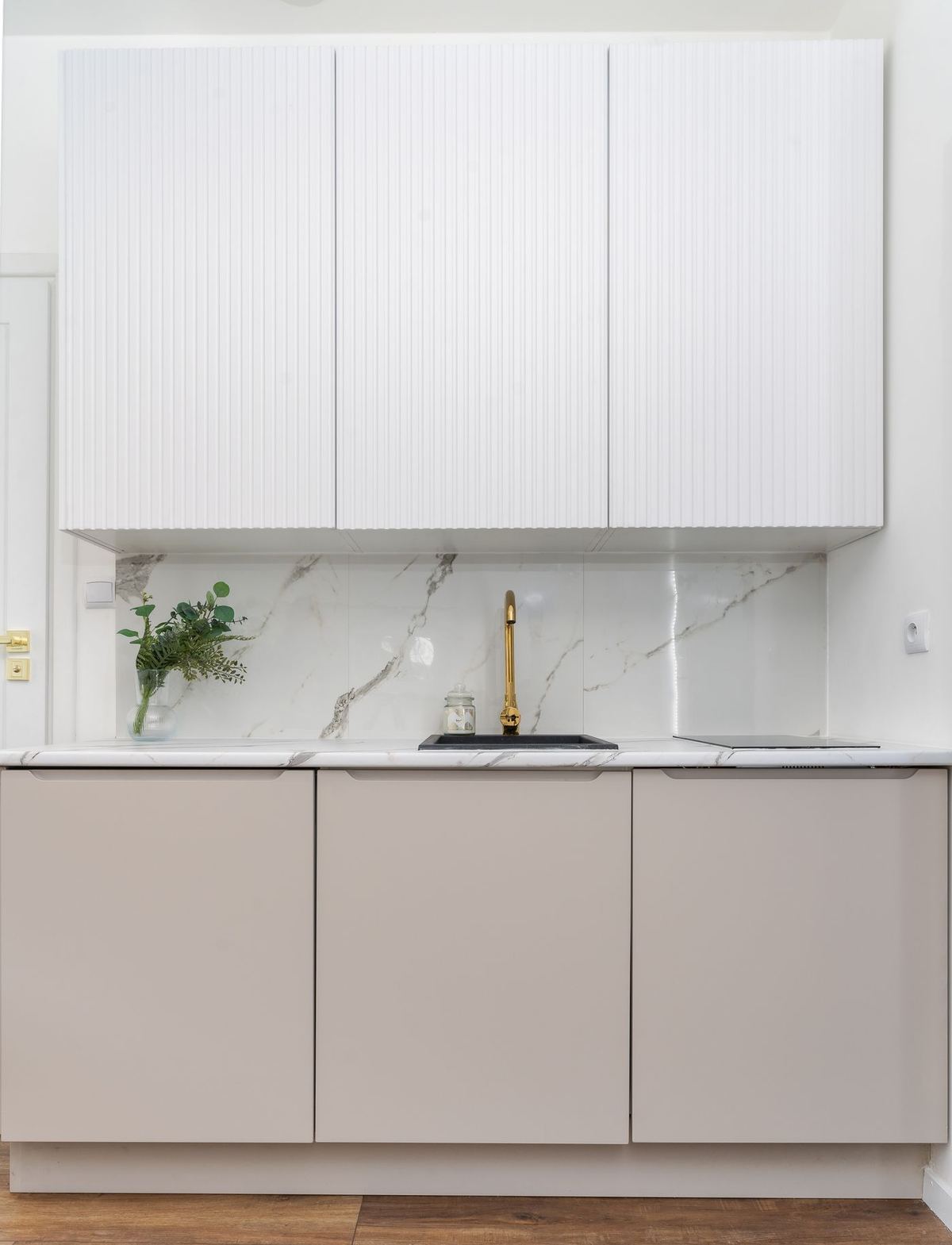 Spotless white kitchen after a deep cleaning